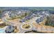An aerial view showcases a residential neighborhood with well-maintained homes and a roundabout at 5247 Flannery Chase Sw, Powder Springs, GA 30127