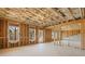 Spacious unfinished basement with exposed framing and natural light, providing a blank canvas for customization at 5247 Flannery Chase Sw, Powder Springs, GA 30127
