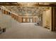 Unfinished basement with concrete walls, exposed ceiling, and natural light ready to be customized at 5247 Flannery Chase Sw, Powder Springs, GA 30127