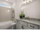 Bathroom features a large mirror, granite counters and shower-tub combination at 5247 Flannery Chase Sw, Powder Springs, GA 30127