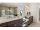 Elegant bathroom with double vanity and built-in bench at 5247 Flannery Chase Sw, Powder Springs, GA 30127