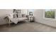 Bedroom has comfortable seating near a window with view of a wooded area at 5247 Flannery Chase Sw, Powder Springs, GA 30127