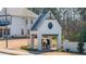 Community entrance with a pergola featuring a Gathering silhouette at 5247 Flannery Chase Sw, Powder Springs, GA 30127