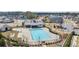 An aerial view showcases a sparkling community pool, clubhouse, and surrounding neighborhood at 5247 Flannery Chase Sw, Powder Springs, GA 30127