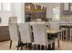 Dining room with a large wooden table, chandelier, and adjacent kitchen at 5247 Flannery Chase Sw, Powder Springs, GA 30127