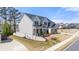 Two-story house, light colored brick and siding, landscaping, and a walkway at 5247 Flannery Chase Sw, Powder Springs, GA 30127