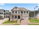 Brick two-story house with gray shutters, two-car garage, and landscaped lawn at 5247 Flannery Chase Sw, Powder Springs, GA 30127