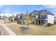 Two-story house, light colored brick and siding, landscaping, and a walkway at 5247 Flannery Chase Sw, Powder Springs, GA 30127