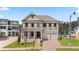 Charming two-story home with brick facade, lush lawn, and two-car garage at 5247 Flannery Chase Sw, Powder Springs, GA 30127