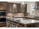 Spacious kitchen island with seating, stainless steel appliances, and white quartz countertops at 5247 Flannery Chase Sw, Powder Springs, GA 30127