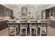 Modern kitchen featuring a center island, stainless steel appliances, and counter seating at 5247 Flannery Chase Sw, Powder Springs, GA 30127
