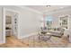 Comfortable living room with hardwood floors, neutral walls, and modern furniture at 5247 Flannery Chase Sw, Powder Springs, GA 30127