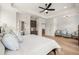 Spacious main bedroom with hardwood floors, tray ceiling, sitting area, and plenty of natural light at 5247 Flannery Chase Sw, Powder Springs, GA 30127