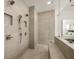 Modern walk-in shower with neutral tile, pebble floor, multiple shower heads, and built-in bench at 5247 Flannery Chase Sw, Powder Springs, GA 30127