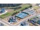 Aerial shot of community tennis courts; well-kept with fencing, landscaping, and parking at 5247 Flannery Chase Sw, Powder Springs, GA 30127