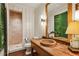 Charming bathroom boasts a wooden vanity, stone sink, shiplap walls, and a walk-in shower with stone surround at 2631 Habersham Nw Rd, Atlanta, GA 30305