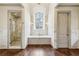 Bright bathroom featuring marble shower, soaking tub and marble vanity with a neutral color palette throughout at 2631 Habersham Nw Rd, Atlanta, GA 30305