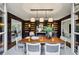 Elegant dining room with dark wood finishes, built-in bookshelves, and ample natural light at 2631 Habersham Nw Rd, Atlanta, GA 30305