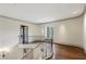 Open foyer with curved staircase, hardwood floors, and large window, leading to additional rooms of the home at 2631 Habersham Nw Rd, Atlanta, GA 30305