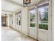 Hallway with large picture windows overlooking a sparkling pool and lush landscaping, providing a serene view at 2631 Habersham Nw Rd, Atlanta, GA 30305