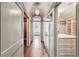 Long hallway features hardwood floors, barrel ceiling and leads to closet space, bathroom and additional bedroom at 2631 Habersham Nw Rd, Atlanta, GA 30305