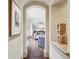 Hallway with wood floors and arched doorway provides a view of the living room and kitchen at 2631 Habersham Nw Rd, Atlanta, GA 30305