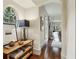 Stylish hallway showcasing hardwood floors, a round window, decorative items, and a glimpse into the living room at 2631 Habersham Nw Rd, Atlanta, GA 30305