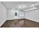 Finished basement with hardwood floors and chandelier at 1325 Cameron Glen Dr, Marietta, GA 30062