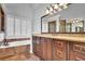 Bathroom with double vanity, soaking tub and large mirror at 1325 Cameron Glen Dr, Marietta, GA 30062
