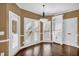 Bright breakfast room with built-in shelving and hardwood floors at 1325 Cameron Glen Dr, Marietta, GA 30062