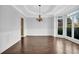Formal dining room with hardwood floors, chandelier, and bay window at 1325 Cameron Glen Dr, Marietta, GA 30062