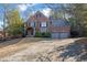 Brick home with three-car garage and long driveway at 1325 Cameron Glen Dr, Marietta, GA 30062