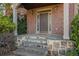 Stone steps leading to a covered porch and dark brown front door at 1325 Cameron Glen Dr, Marietta, GA 30062