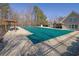 Community pool with a green cover and surrounding fence at 1325 Cameron Glen Dr, Marietta, GA 30062