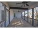 Spacious screened porch with wood flooring and ceiling fans at 1325 Cameron Glen Dr, Marietta, GA 30062