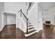 Dark wood staircase with white railing and access to the second floor at 1325 Cameron Glen Dr, Marietta, GA 30062