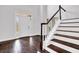 Elegant staircase with dark wood steps and white railing at 1325 Cameron Glen Dr, Marietta, GA 30062