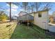 Exterior view of a home with a fenced backyard and deck at 749 Scarlet Ne Dr, Kennesaw, GA 30144