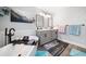 Modern bathroom with a freestanding tub, double vanity, stylish mirrors and hardwood floors at 749 Scarlet Ne Dr, Kennesaw, GA 30144