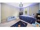 Cozy bedroom featuring a blue color scheme, decorative lighting and fun rug at 749 Scarlet Ne Dr, Kennesaw, GA 30144