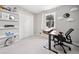 Cozy bedroom featuring a large window, closet, and a functional workspace for productivity at 749 Scarlet Ne Dr, Kennesaw, GA 30144