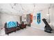 Cozy bonus room with stylish lighting, comfortable seating, and a view of the backyard at 749 Scarlet Ne Dr, Kennesaw, GA 30144