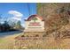 Entrance to the Country Plantation Swim & Tennis community with attractive stone base and manicured landscaping at 749 Scarlet Ne Dr, Kennesaw, GA 30144