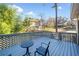 View of the cozy outdoor deck with seating, perfect for relaxation and enjoying the surrounding greenery at 749 Scarlet Ne Dr, Kennesaw, GA 30144