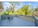 Wood deck with outdoor seating area overlooking a lush green space at 749 Scarlet Ne Dr, Kennesaw, GA 30144