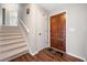 Welcoming foyer features beautiful flooring, staircase, and a solid wood front door at 749 Scarlet Ne Dr, Kennesaw, GA 30144