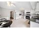 Spacious kitchen features white cabinets and appliances, complemented by granite countertops and a bright, airy ambiance at 749 Scarlet Ne Dr, Kennesaw, GA 30144