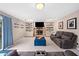 Inviting living room with stone fireplace and built-ins, offering ample space for relaxation and entertainment at 749 Scarlet Ne Dr, Kennesaw, GA 30144