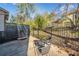 Concrete patio with outdoor seating in fenced yard at 749 Scarlet Ne Dr, Kennesaw, GA 30144