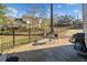Concrete patio with outdoor seating and grill in fenced yard at 749 Scarlet Ne Dr, Kennesaw, GA 30144